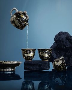 Enjoying tea with gilded silver tea set