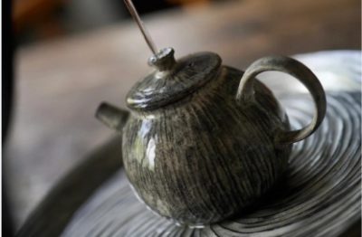 Bathing Yixing teapot with tea