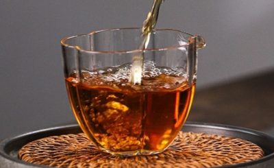 Glass teapot brewing tea